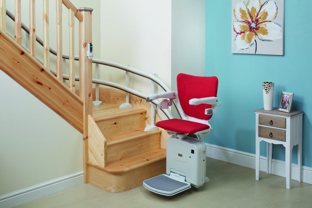 Handicare 2000 with cherry red seat - Curved Stairlifts